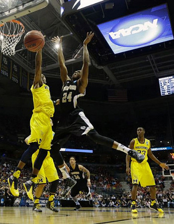 Glenn Robinson III (1) and Caris LeVert (23)