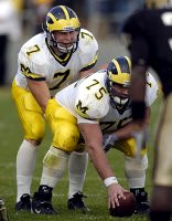 David Baas (75) and Chad Henne (7)