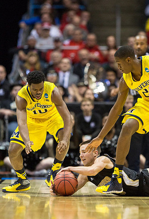 Derrick Walton Jr. (10) and Caris LeVert (23)