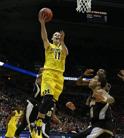 Nik Stauskas (11) and Caris LeVert (23)