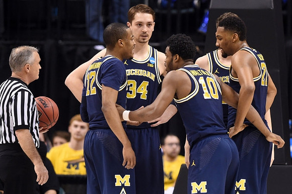 Muhammad-Ali Abdur-Rahkman (12), Mark Donnal (34), Derrick Walton Jr. (10), Moritz Wagner (13), and Zak Irvin (21)