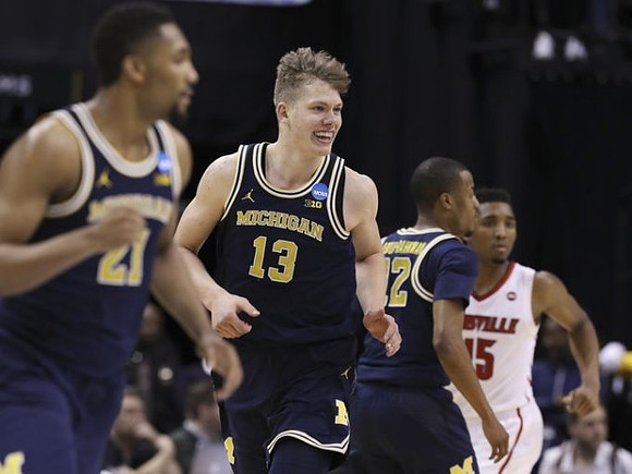 Zak Irvin (21), Moritz Wagner (13), and Muhammad-Ali Abdur-Rahkman (12)