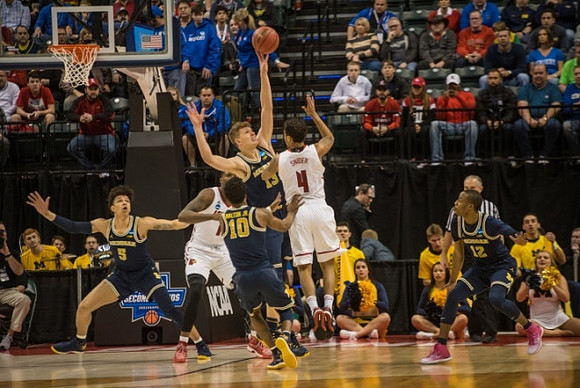 D.J. Wilson (5), Derrick Walton Jr. (10), Moritz Wagner (13), and Muhammad-Ali Abdur-Rahkman (12)
