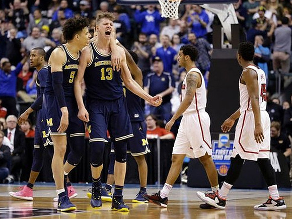 D.J. Wilson (5) and Moritz Wagner (13)