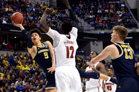 D.J. Wilson (5) and Moritz Wagner (13)