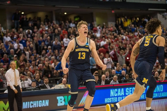 John Beilein, Moritz Wagner (13), and D.J. Wilson (5)