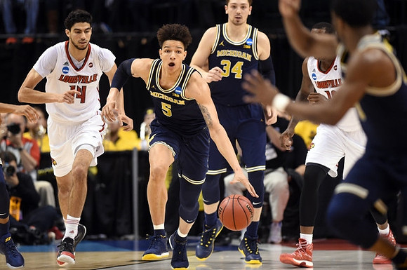 D.J. Wilson (5) and Mark Donnal (34)