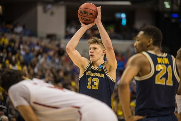 Moritz Wagner (13) and Zak Irvin (21)