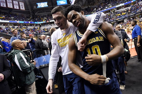 Sean Lonergan (20) and Derrick Walton Jr. (10)