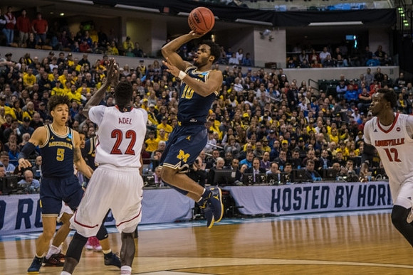 D.J. Wilson (5) and Derrick Walton Jr. (10)