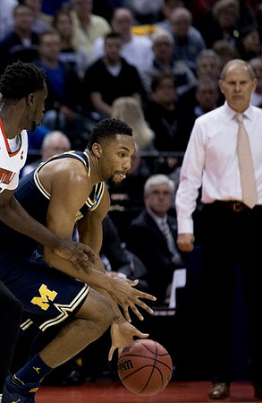 Zak Irvin (21) and John Beilein