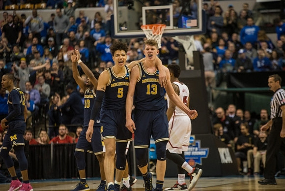 Muhammad-Ali Abdur-Rahkman (12), Derrick Walton Jr. (10), D.J. Wilson (5), and Moritz Wagner (13)