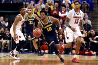 Zak Irvin (21) and Derrick Walton Jr. (10)