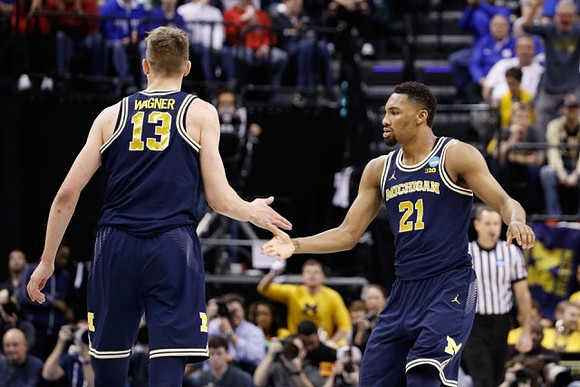 Moritz Wagner (13) and Zak Irvin (21)