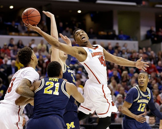Zak Irvin (21), Mark Donnal (34), and Muhammad-Ali Abdur-Rahkman (12)