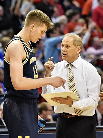 Moritz Wagner (13) and John Beilein