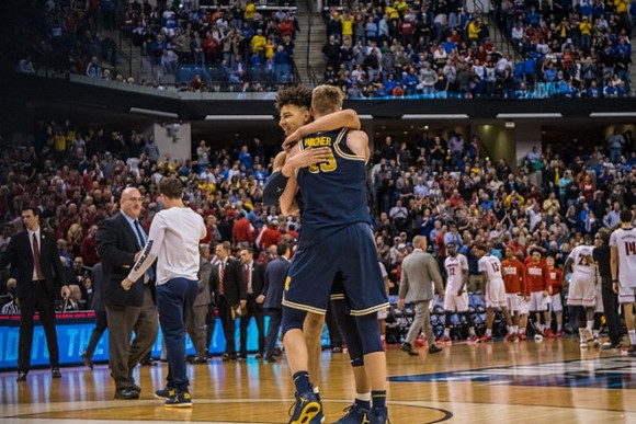 D.J. Wilson (5) and Moritz Wagner (13)