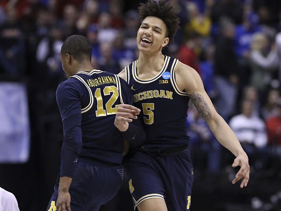 Muhammad-Ali Abdur-Rahkman (12) and D.J. Wilson (5)