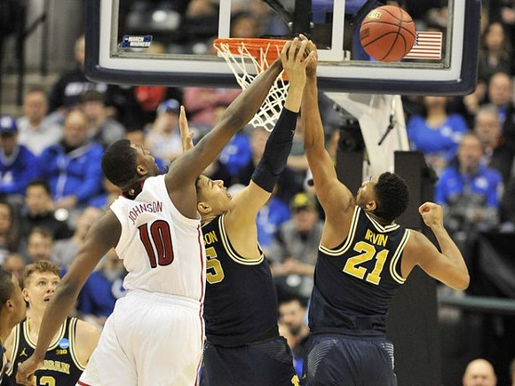 Muhammad-Ali Abdur-Rahkman (12), Moritz Wagner (13), D.J. Wilson (5), and Zak Irvin (21)