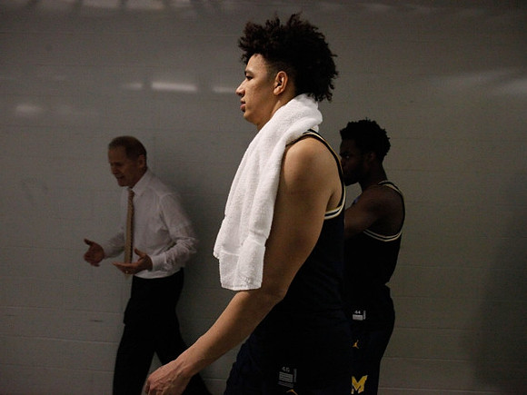 John Beilein, D.J. Wilson (5), and Derrick Walton Jr. (10)