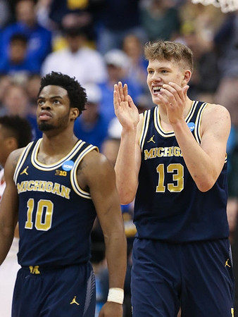 Derrick Walton Jr. (10) and Moritz Wagner (13)