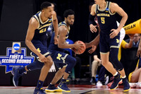 Zak Irvin (21), Derrick Walton Jr. (10), and D.J. Wilson (5)