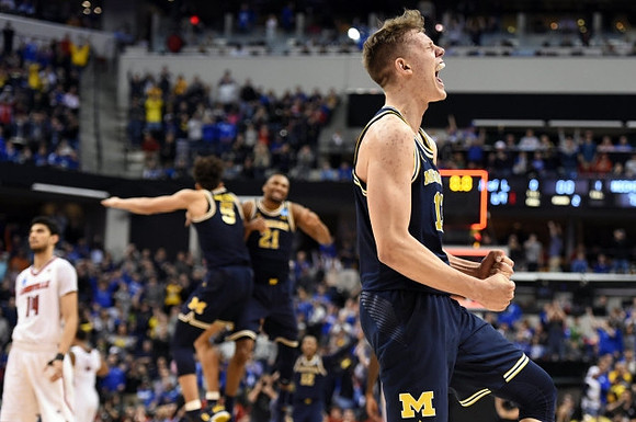 Moritz Wagner (13), D.J. Wilson (5), and Zak Irvin (21)