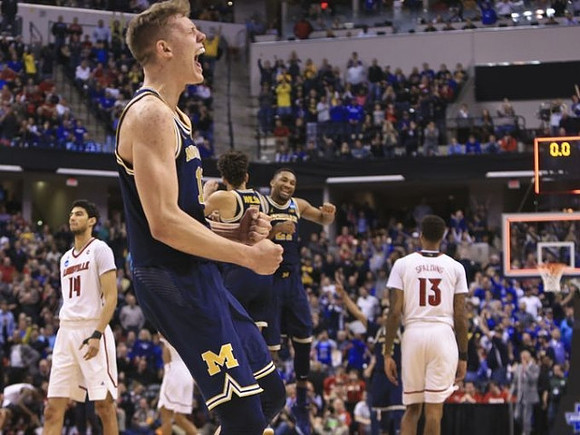 Moritz Wagner (13), D.J. Wilson (5), and Zak Irvin (21)