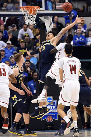 Moritz Wagner (13) and D.J. Wilson (5)