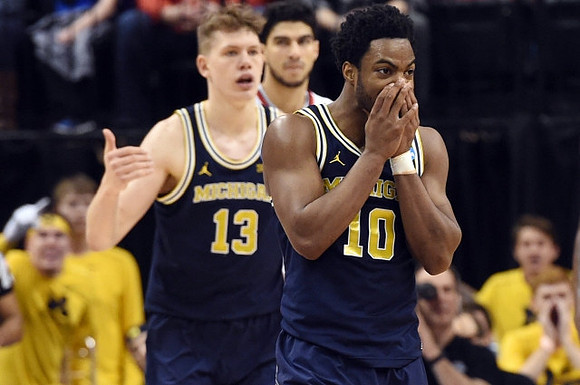 Moritz Wagner (13) and Derrick Walton Jr. (10)