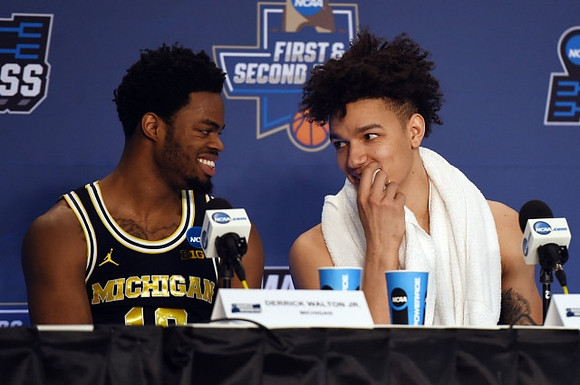Derrick Walton Jr. (10) and D.J. Wilson (5)