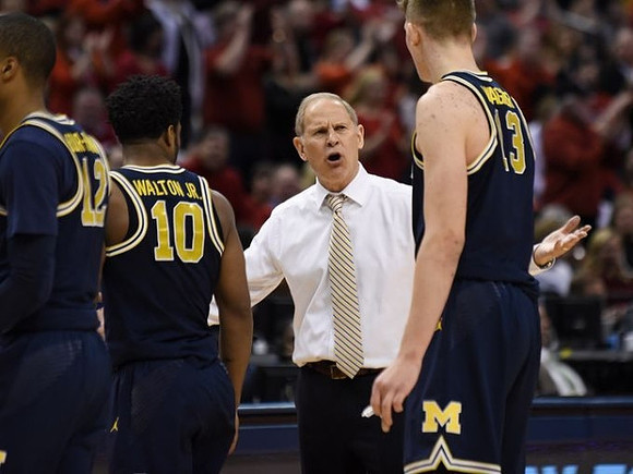 Muhammad-Ali Abdur-Rahkman (12), Derrick Walton Jr. (10), John Beilein, and Moritz Wagner (13)