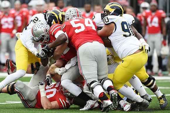 Jarrod Wilson (22) and Bryan Mone (90)
