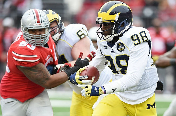Graham Glasgow (61) and Devin Gardner (98)