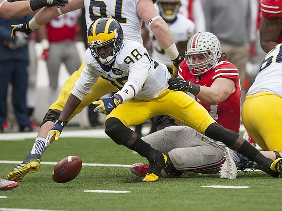 Devin Gardner (98) and Graham Glasgow (61)