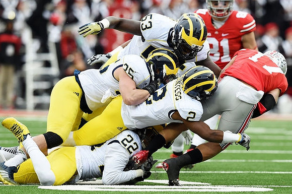 Jarrod Wilson (22), Blake Countess (2), Joe Bolden (35), and Mario Ojemudia (53)