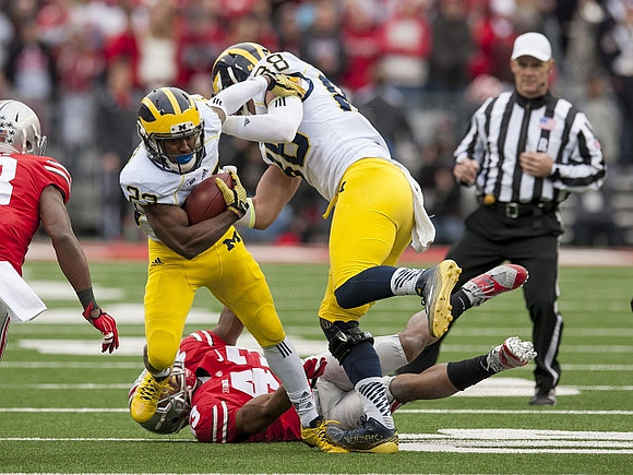 Dennis Norfleet (23) and Devin Gardner (98)