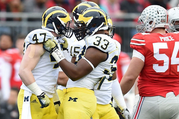 Jake Ryan (47), James Ross (15), and Taco Charlton (33)
