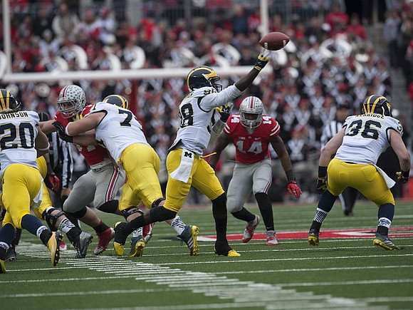 Drake Johnson (20), Ben Braden (71), Devin Gardner (98), and Joe Kerridge (36)