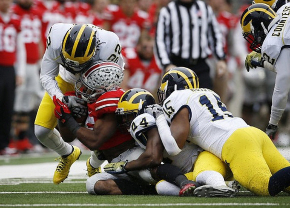 Jarrod Wilson (22), Delano Hill (44), and James Ross (15)