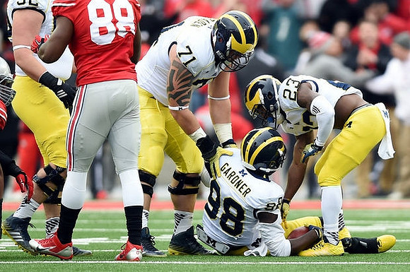 Mason Cole (52), Ben Braden (71), Devin Gardner (98), and Dennis Norfleet (23)
