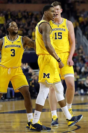 Zavier Simpson (3), Charles Matthews (1), and Jon Teske (15)