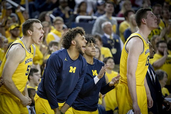 Austin Davis (51), Isaiah Livers (4), Eli Brooks (55), and Jon Teske (15)