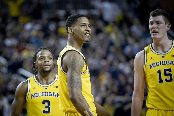 Zavier Simpson (3), Charles Matthews (1), and Jon Teske (15)