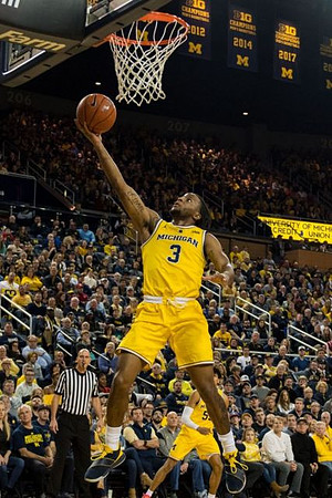 Zavier Simpson (3) and Eli Brooks (55)