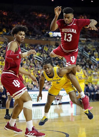 Zavier Simpson (3) and Eli Brooks (55)