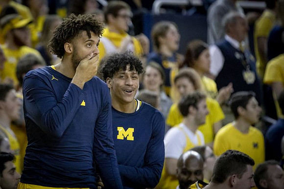 Isaiah Livers (4) and Eli Brooks (55)