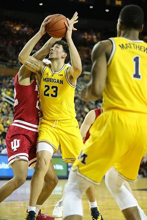 Brandon Johns Jr. (23) and Charles Matthews (1)