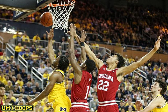 Zavier Simpson (3) and Brandon Johns Jr. (23)