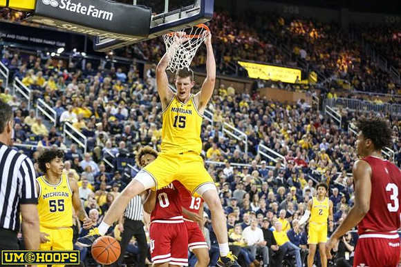 Jon Teske (15), Eli Brooks (55), and Jordan Poole (2)